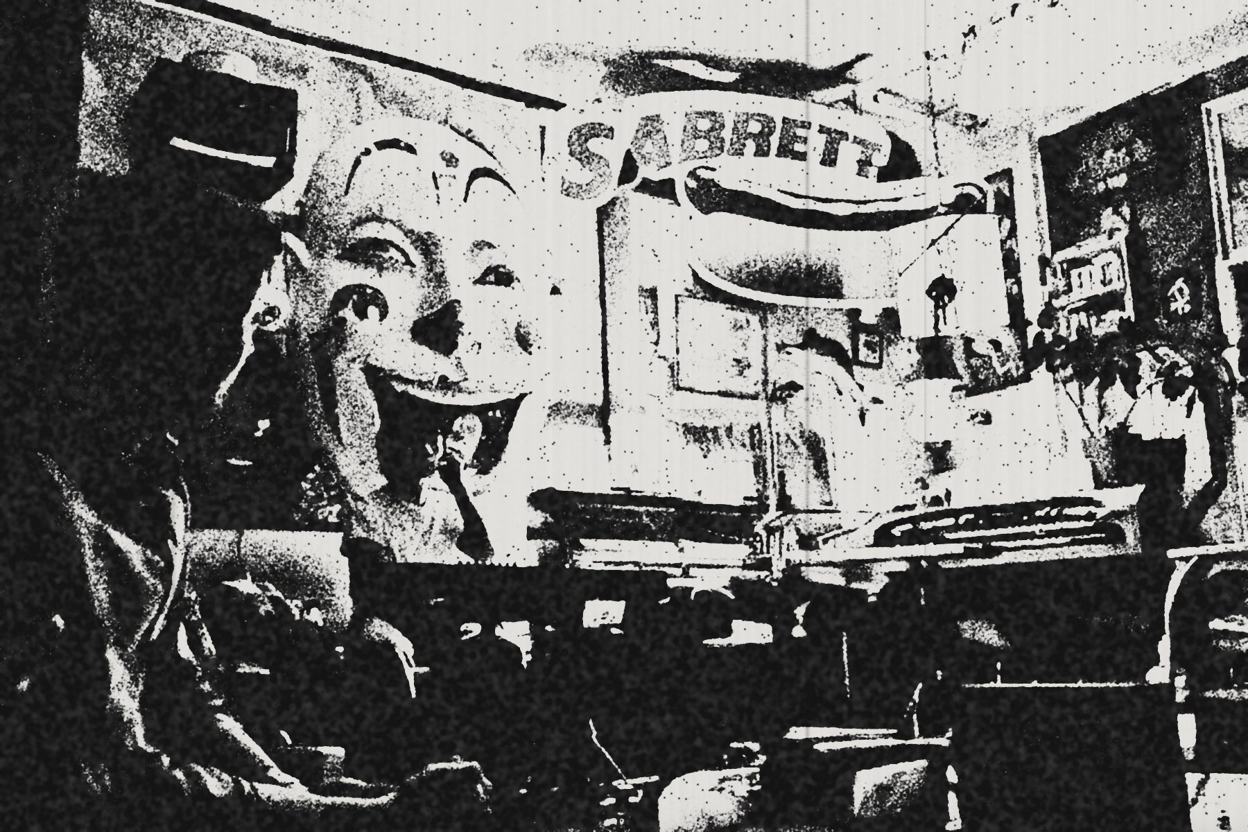 The giant clown face and the Sabrett sign above the stage at Brothers Wash and Dry, as a photocopy